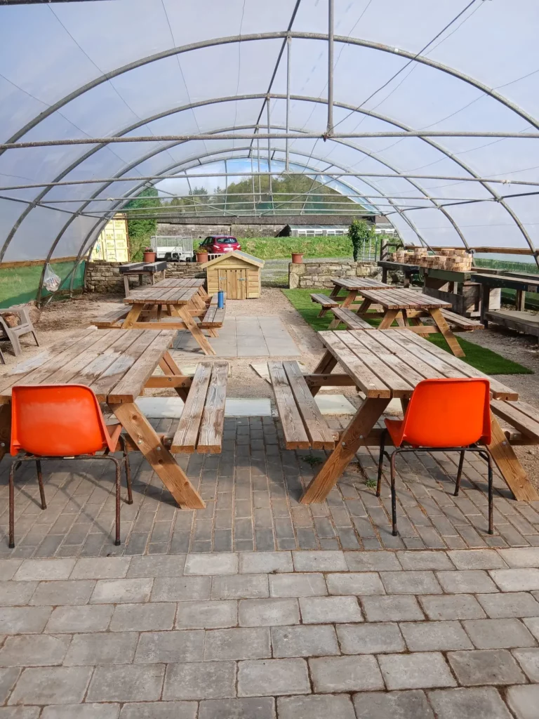 Covered outdoor seating and picnic area at Carriglea community project